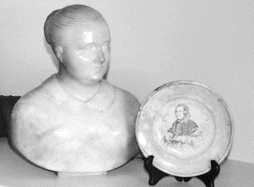 Chisholm’s portrait bust from the Pope, and a small plate entitled ‘The Emmigrant’s Friend’