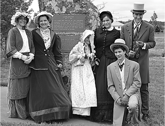A group of people dressed in period costumes