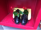 A pair of shoes with flowers in them