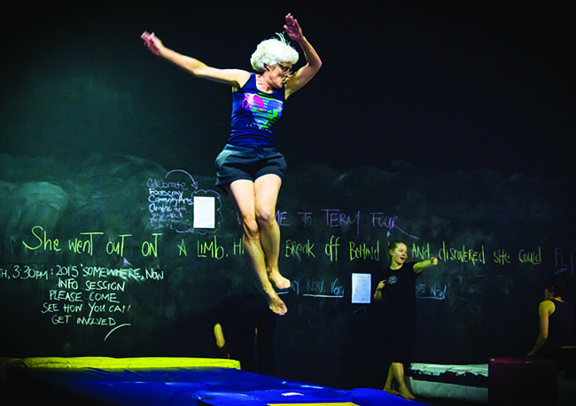 Woman on trampoline.
