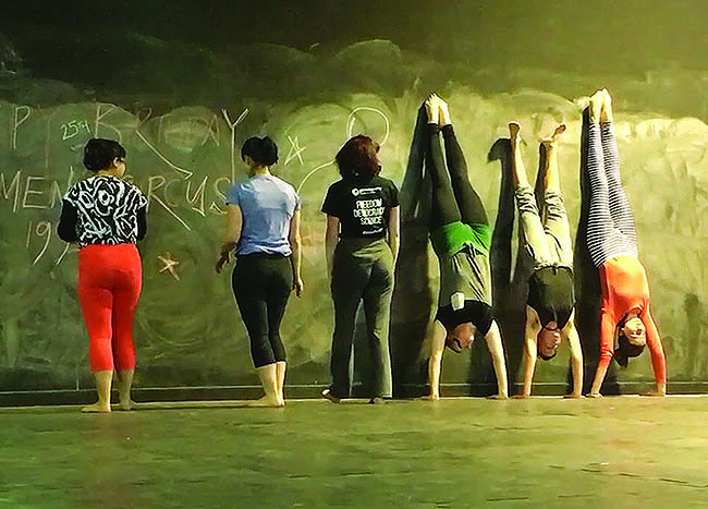 Group of women in front of wall